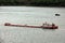 Seagoing vessels, barges, tugboats and small boats at the roadstead of Halong bay under cargo operations and underway. Port of Cam