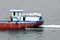 Seagoing vessels, barges, tugboats and small boats at the roadstead of Halong bay under cargo operations and underway. Port of Cam