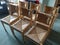 Seagrass dining chairs set in rows