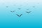 Seagull birds fly over the sea on a blue gradient background wallpaper vector