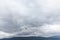 Seagull in cloudy sky. Seagull flying in cloudy sky. Seagull flying over fjord