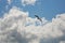 Seagull flying in blue cloudy sky