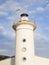 Seagull flying on a lighthouse tower