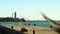 Seagull lighthouse and sea. Seagulls take off from the old pier fly around