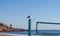 Seagull perched on a volleyball court post