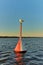 Seagull sitting on a navigation marker buoy in Vistula Lagoon