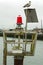 A Seagull Sitting on Top of a Marine Warning Light Assembly