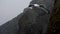 Seagull slow motion flight at backdrop of the rocks and catch pieces of the bread