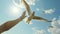 A seagull, soaring in the sky, hand up to the sky and seagull in flight on blue sky background