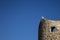 Seagull standing on an ancient tower