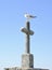 Seagull on stone cross