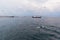 Seagulls circle around the ferry going to Olkhon Island in the Olkhonskiye Vorota Strait. Russia, lake Baikal, Siberia