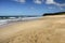 Seagulls and deserted sandy beach.