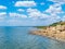 Seagulls on the seashore, beautiful sky with clouds, rocky coastline