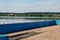 Seagulls are sitting on pier on shore of large lake