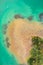 Seagulls on tropical sandy island surrounded by azure water - top view