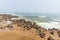The seal colony at Cape Cross, on the atlantic coastline of Namibia, Africa. Expansive view on the beach, the rough ocean and the