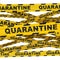Sealing off a dangerous area with yellow warning tape with the word Quarantine