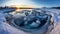 Seals basking in sunrise glow on icy outcropping