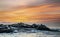 Seals silhouettes on the rock island. Sunrise Sky Background. Seal Island on sunrise. Cape fur seal, Scientific name: