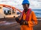 Seaman AB or Bosun on deck of vessel or ship , wearing PPE