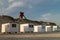 Seamark in sand dunes with beach cabins