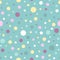 Seamless abstract pattern of circles of different colors and size on turquoise background. Kaleidoscope