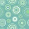 Seamless abstract pattern of circles and dots of green and turquoise colors. Kaleidoscope background.