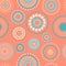 Seamless abstract pattern of circles and dots of orange and turquoise colors. Kaleidoscope background.