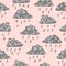 Seamless abstract rainy pattern with hand drawn clouds and rain drops