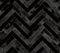 Seamless abstract zigzag geometric herringbone pattern with watercolor and gold lines on black background