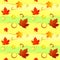 Seamless asymmetric pattern of autumn leaves in warm colors