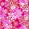 seamless asymmetric pattern of colorful snowflakes on a pink background