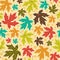 Seamless autumn pattern from bright maple leaves