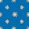 Seamless background of drawn cheerful stars in blue sky