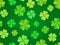 Seamless background with green shamrock.