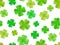 Seamless background with green shamrock.