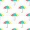 Seamless background with open colorful funny umbrellas on white. Overcast pattern