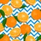 Seamless background with oranges and leaves on a blue and white geometric background.