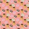 Seamless background with a pattern of donuts with chocolate.