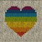 Seamless background with rainbow knitted heart