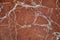 Seamless background of a red marble texture slab