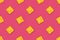 Seamless background of square cracker on pink color