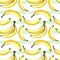 Seamless background of watercolor drawings of bananas and decorative stripes