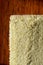 Seamless beige carpet rug texture background from above, mahogany wood parquet