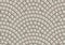 Seamless beige texture of radial street pavement. Repeating circle pattern of cobble stone background