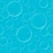 Seamless blue background with flying transparent soap bubbles wi
