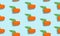 Seamless blue background with slice carrots with leaves and shade