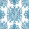 Seamless blue crosshatch tribal rug motif pattern.