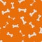 Seamless bones pattern isolated on orange background. Pets food texture.